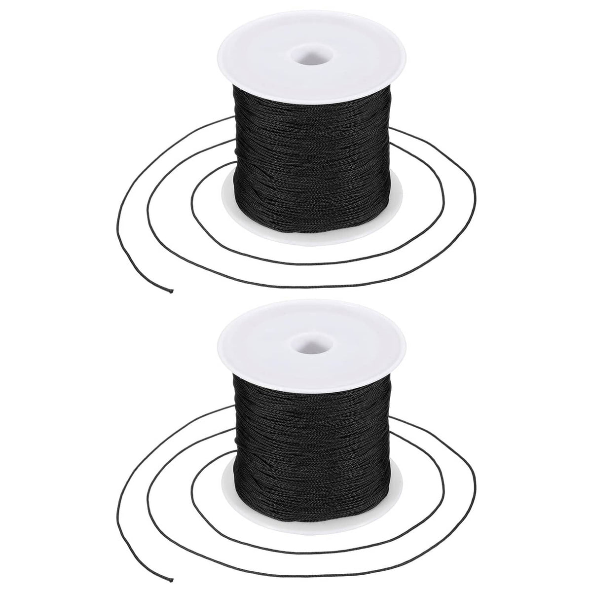 Black 0.6mm nylon string on two white spools for bracelet making