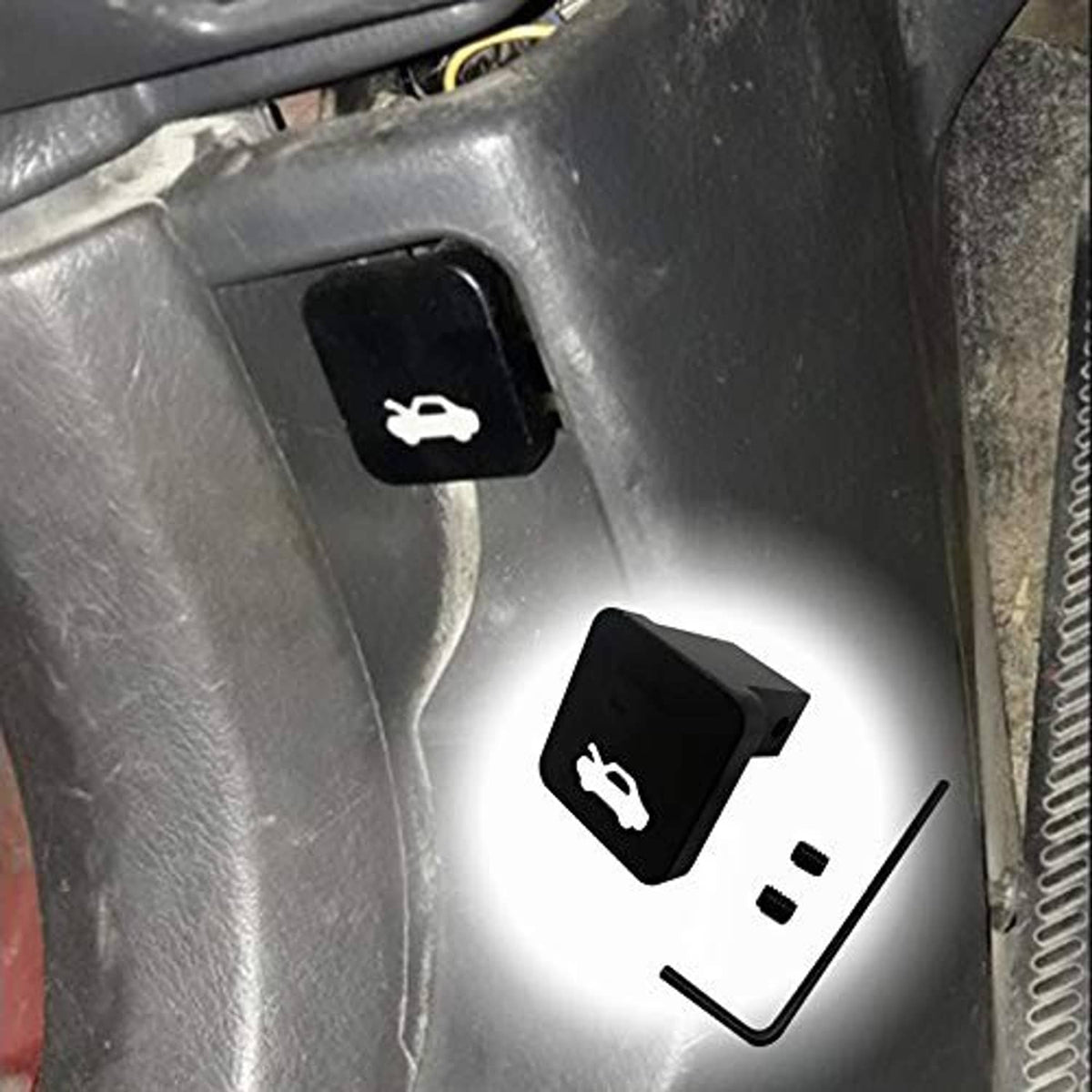 Hood latch release handle repair kit installed on a vehicle, with hex key and screws