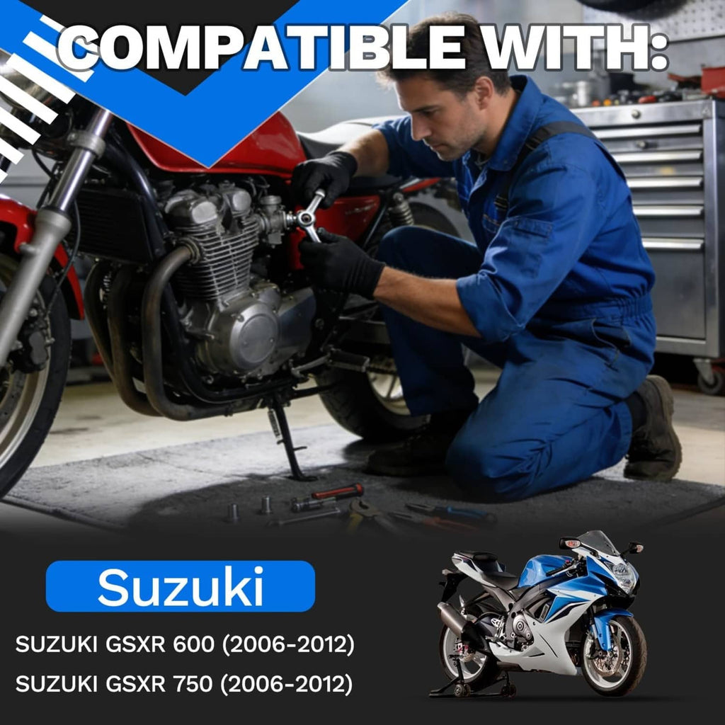 Mechanic kneeling beside sport motorcycle engine, reaching toward wiring and connector on bike
