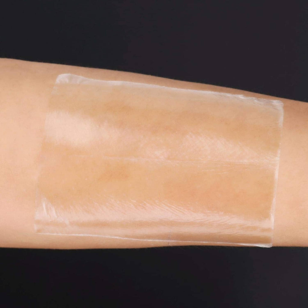 Beige underarm sweat pad adhesive stuck to skin, thin transparent protection layer