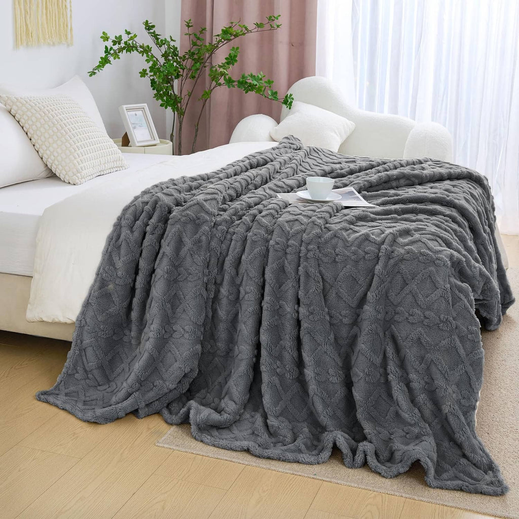 Gray fuzzy king-size throw blanket with textured raised pattern