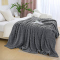 Gray fuzzy king-size throw blanket with textured raised pattern