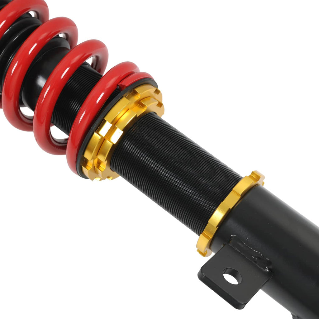 Coilover strut with red spring, yellow collar, ribbed black spring perch, and bracket