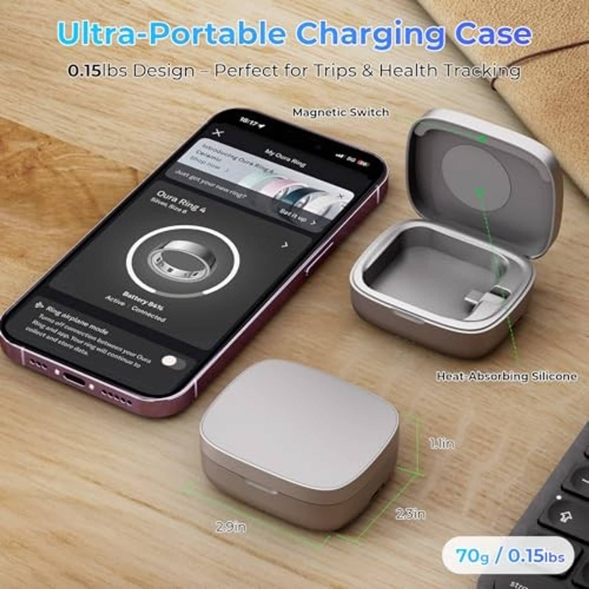 Gray Oura Ring charging case with lid open beside small power module on desk
