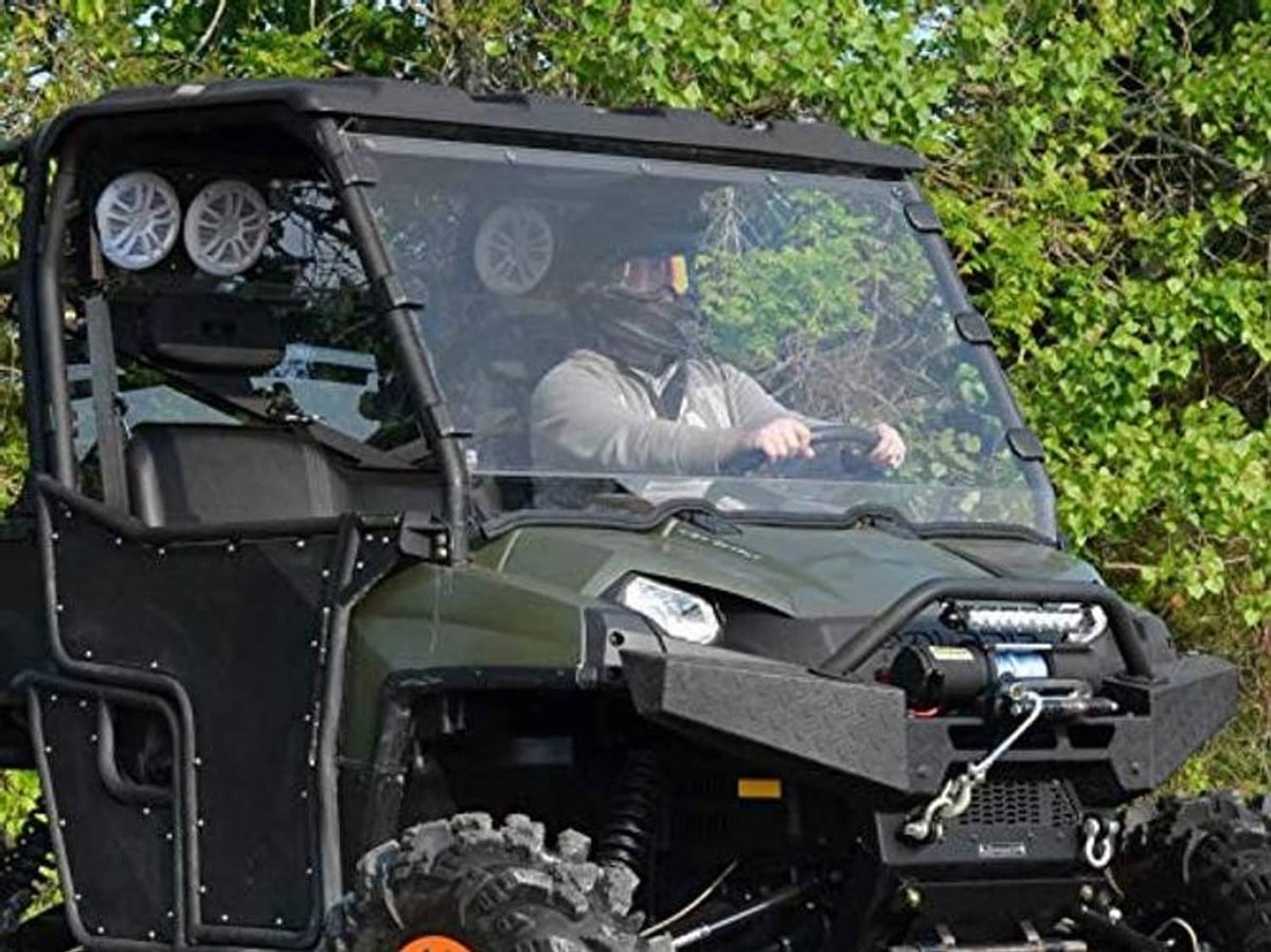 Clear full windshield for UTV with black frame, front bracing, and side panel
