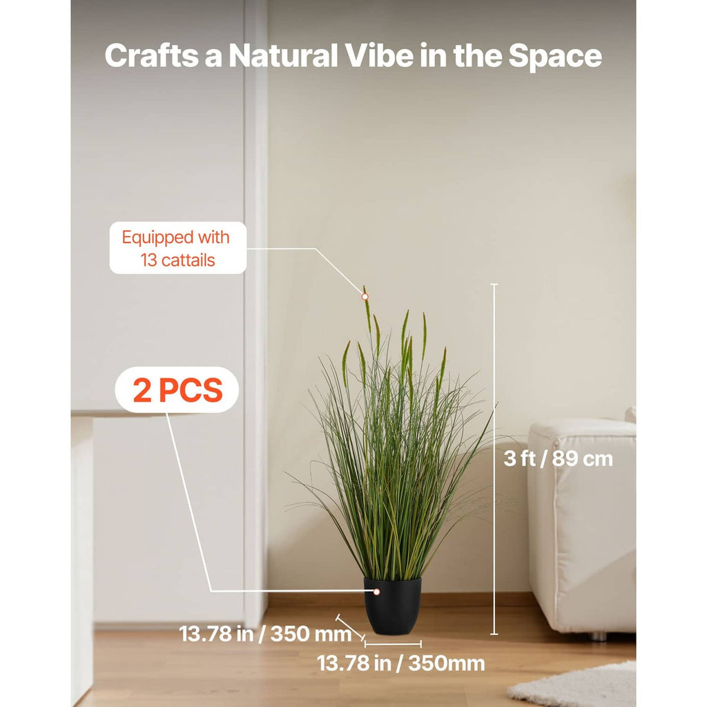 Artificial cattail grass plant in a black pot with upright green stems for indoor decor