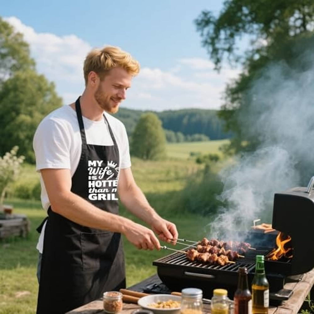 Outdoor grilling apron, black with 'MY Wife is HOTTER than my GRILL' humorous design