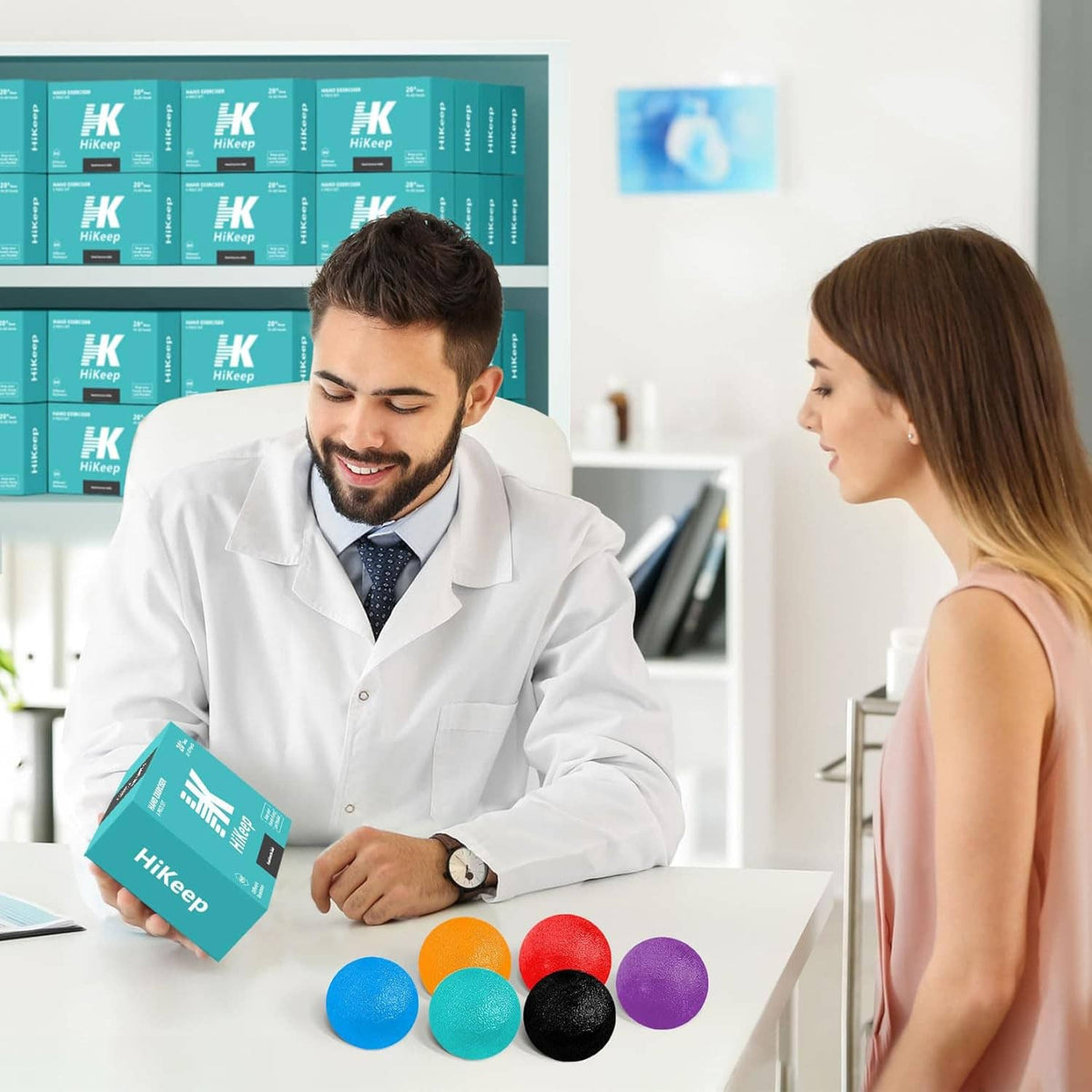 Six hand exercise balls on a table: orange, red, purple, blue, teal, and black.