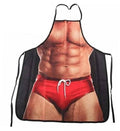 Funny muscle-man grilling apron with red shorts graphic and black tie straps