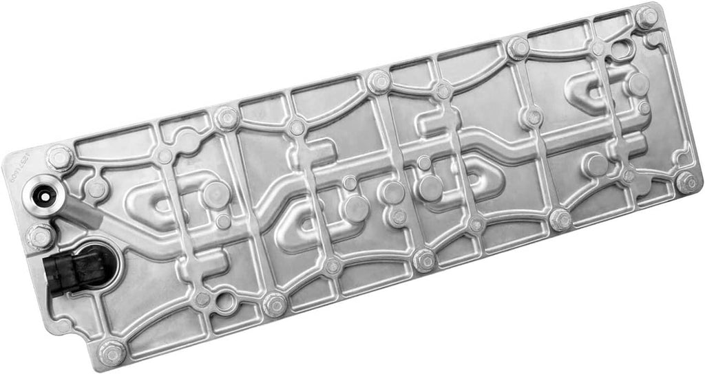 Valve cover underside with molded passages and a black electrical plug