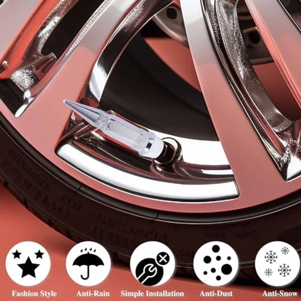 Spiked tire valve stem caps in silver on a vehicle wheel with valve stem openings