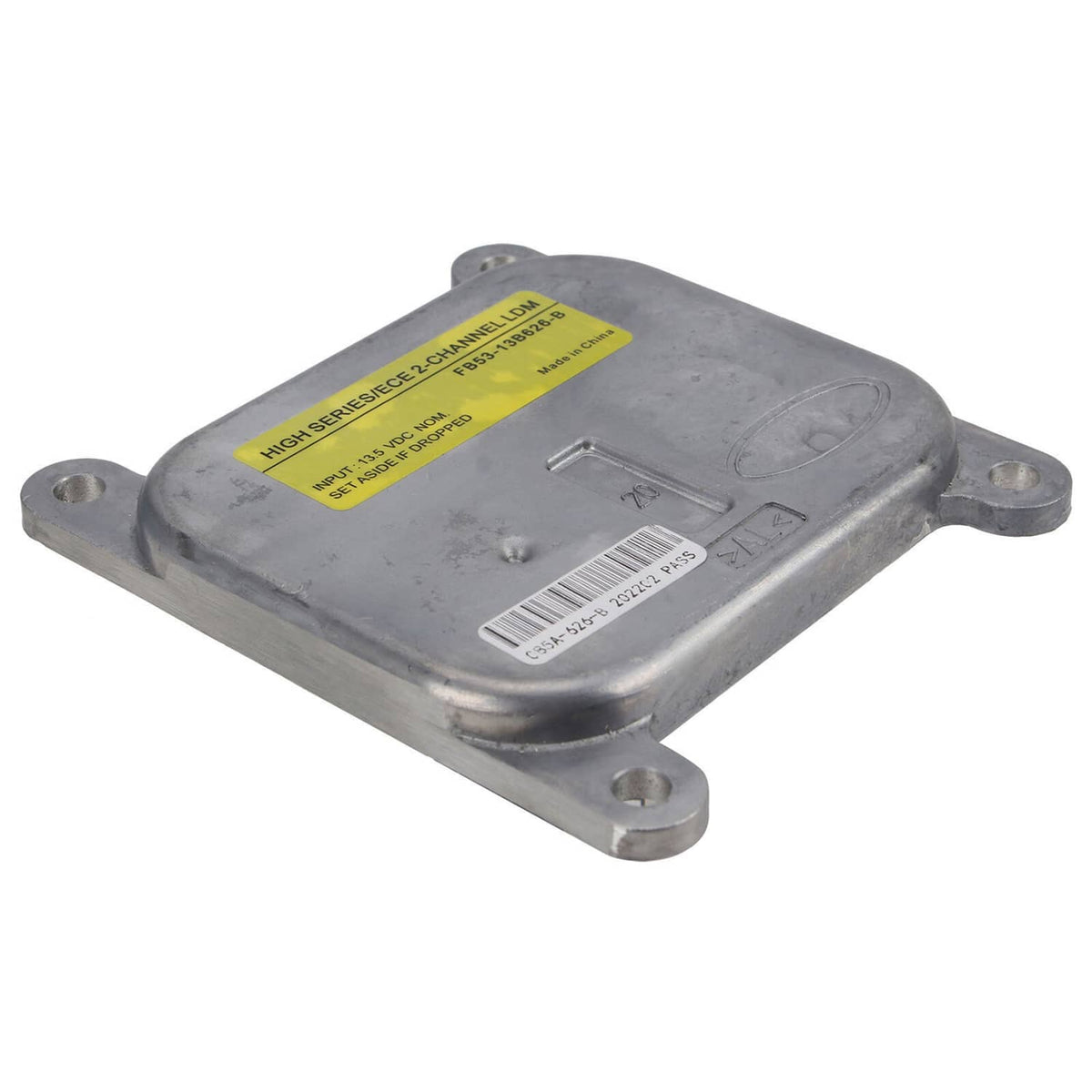 LED headlight control module with yellow label, metal housing, and four mounting tabs