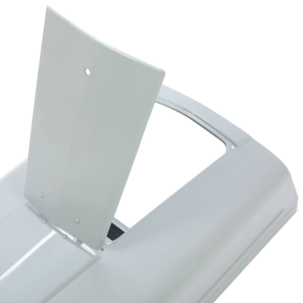 Battery door and mounting area on gray tractor hood, showing hinge points