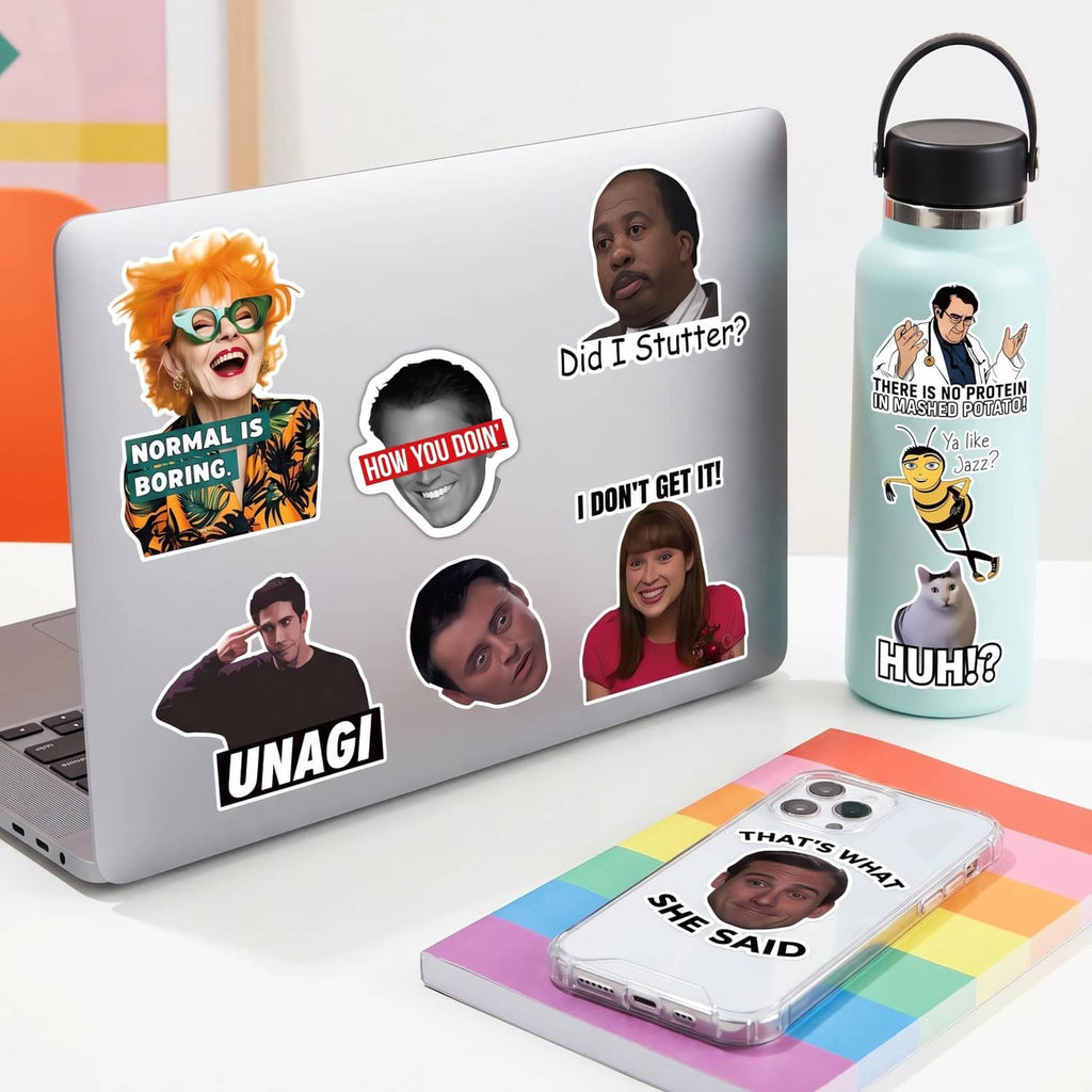 Assorted colorful meme sticker set with cartoon and photo cutouts on a product display
