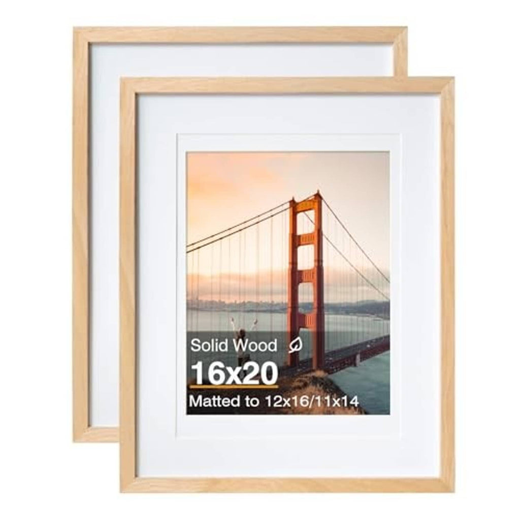 Two natural wood picture frames with white mat and centered photo window