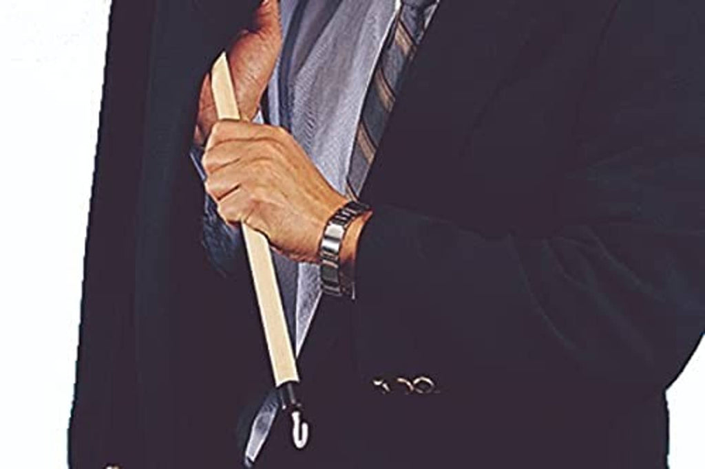 Mobility dressing stick held in hand, using a white hook end to pull clothing