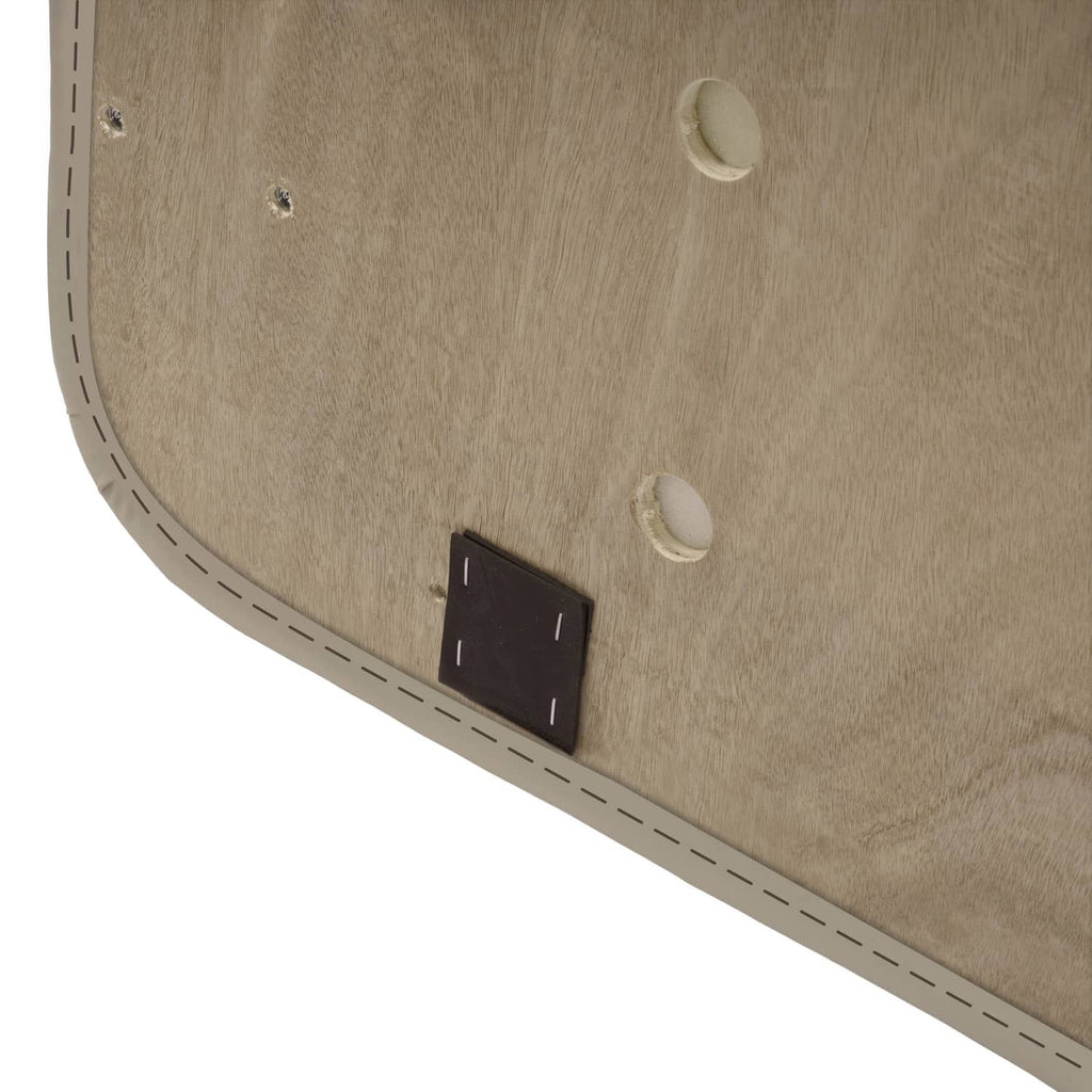 Beige cushion base close-up with black rectangular fastener and mounting holes