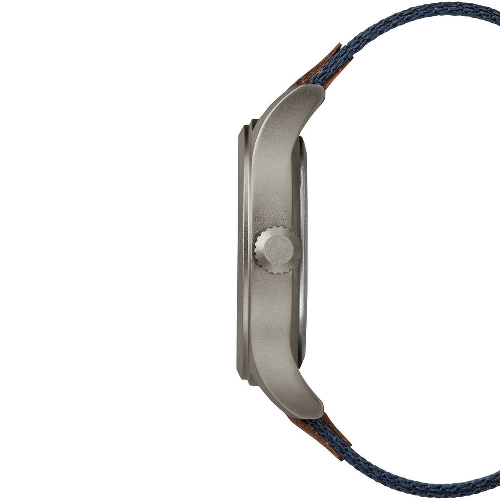 Gray wristwatch case side profile with crown and blue woven fabric strap