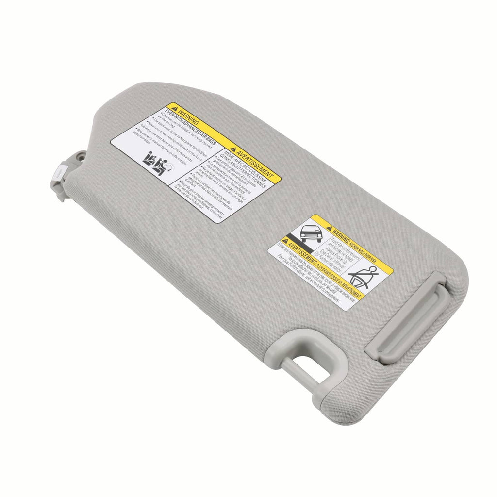 Light gray left driver sun visor with safety label and hinge