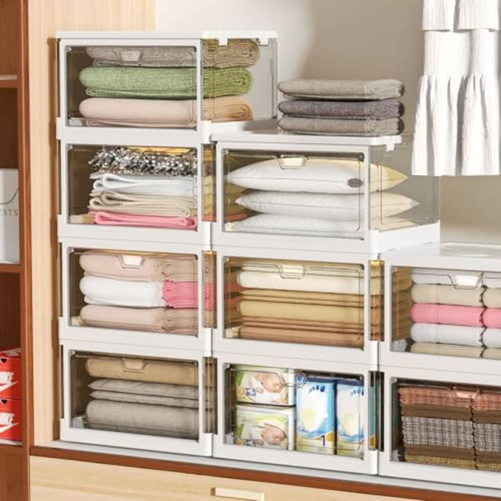 White collapsible storage bins with lids, storing folded clothes on shelves