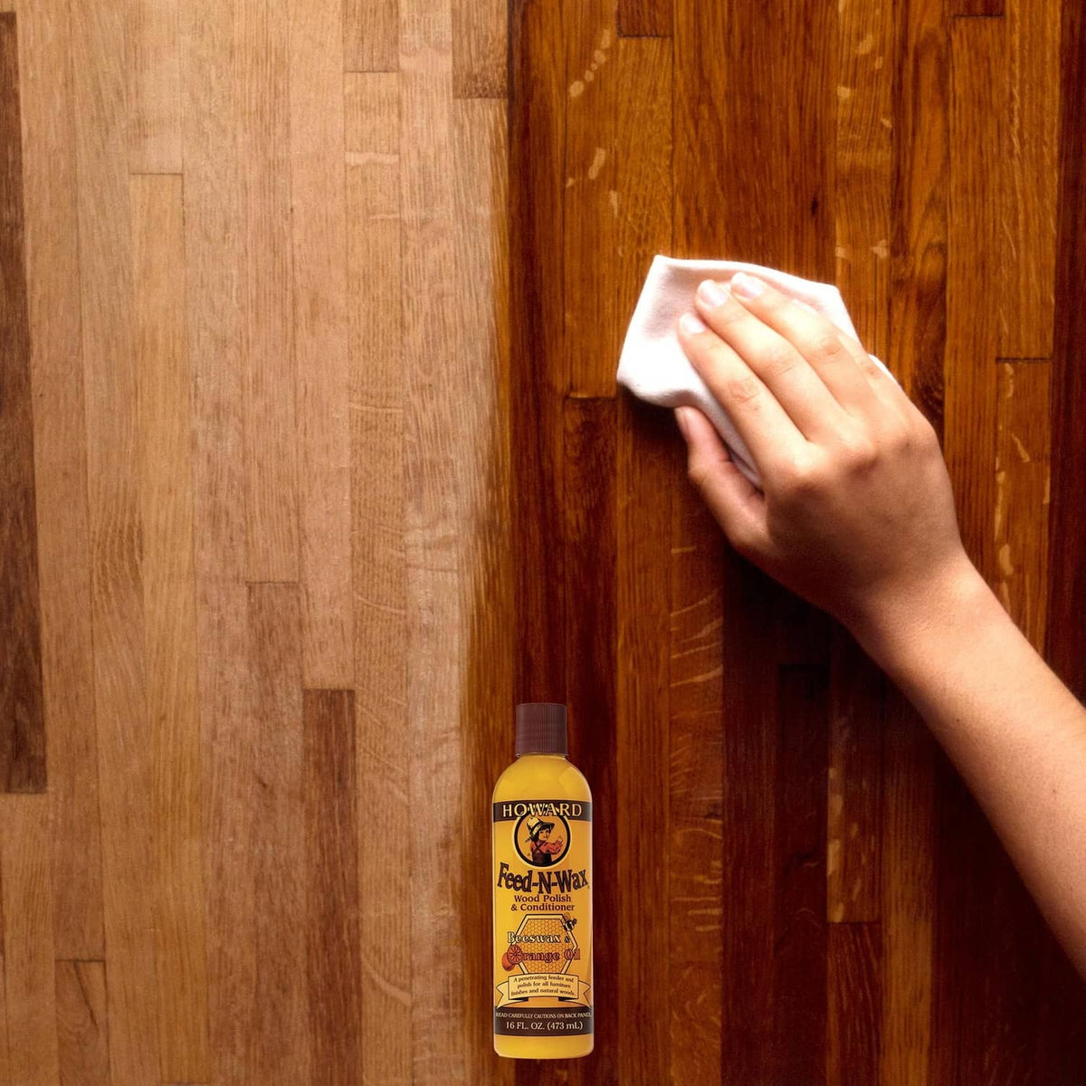 Howard Feed-N-Wax wood polish bottle on wooden floor