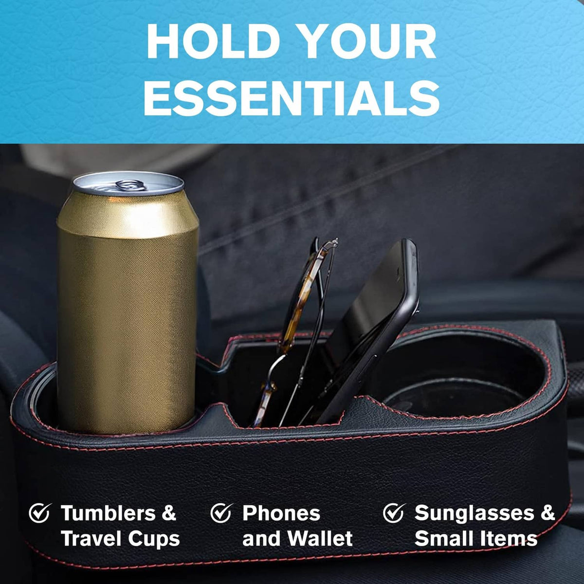 Black car console organizer with cup holder and slots holding a tumbler, phone, and sunglasses