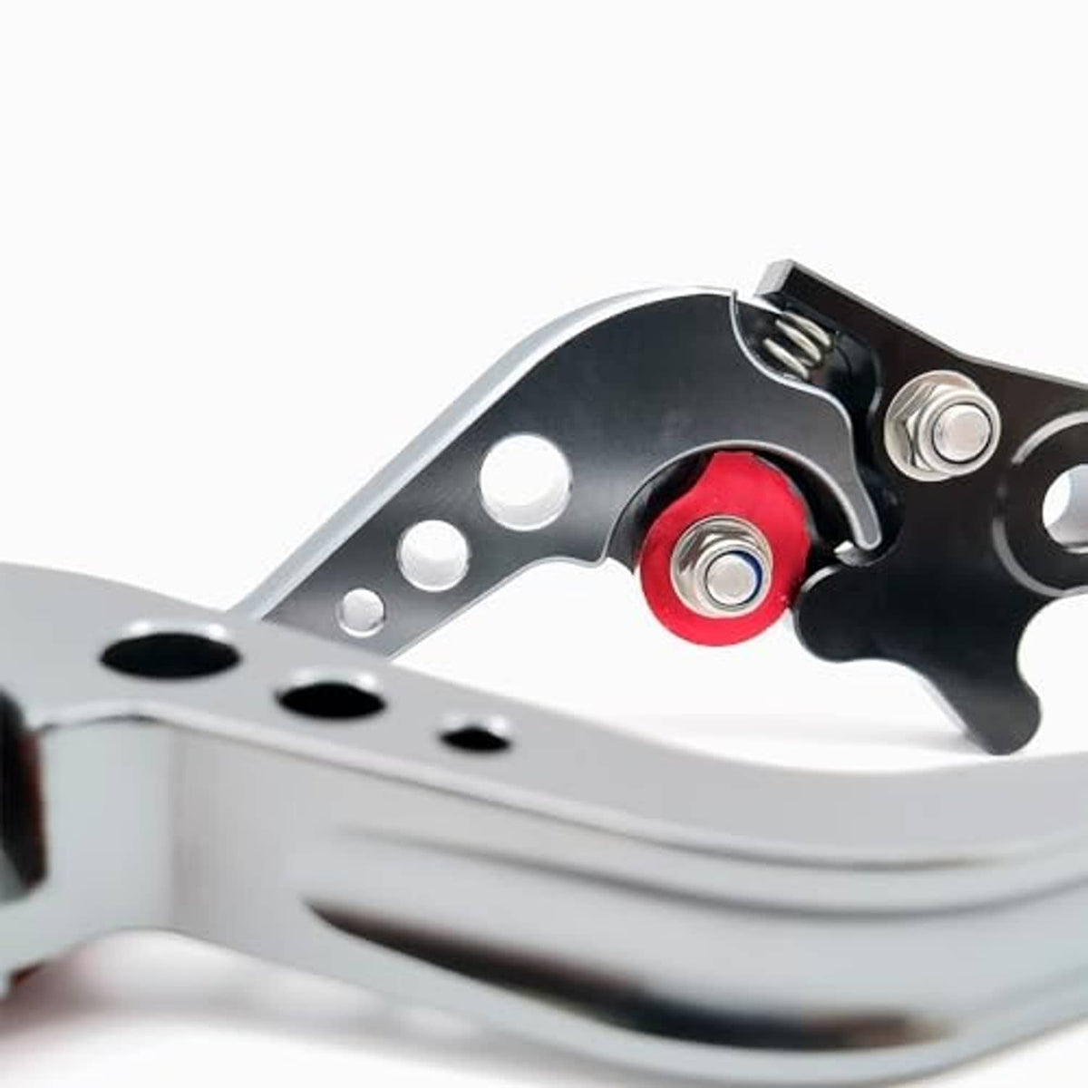 Close-up of motorbike brake lever pivot with red insert on black bracket