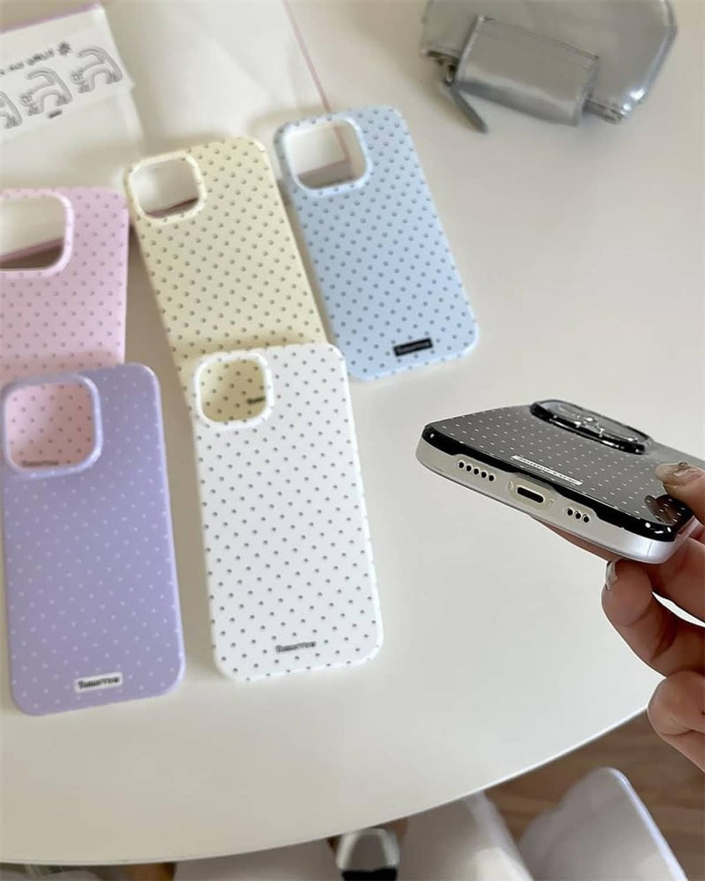 Light blue dotted iPhone 13 Pro case with camera cutouts and charging port