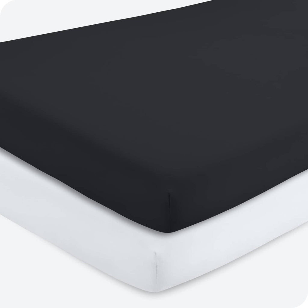 Black microfiber crib fitted sheet with fitted corners and elastic trim