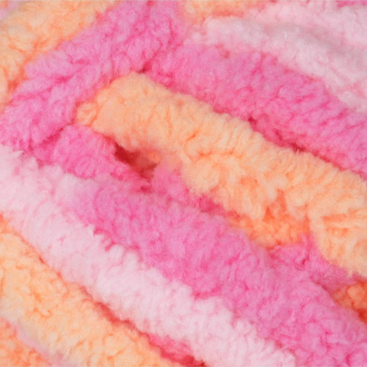 Multicolor chenille yarn texture with peach, pink, and white plush loops