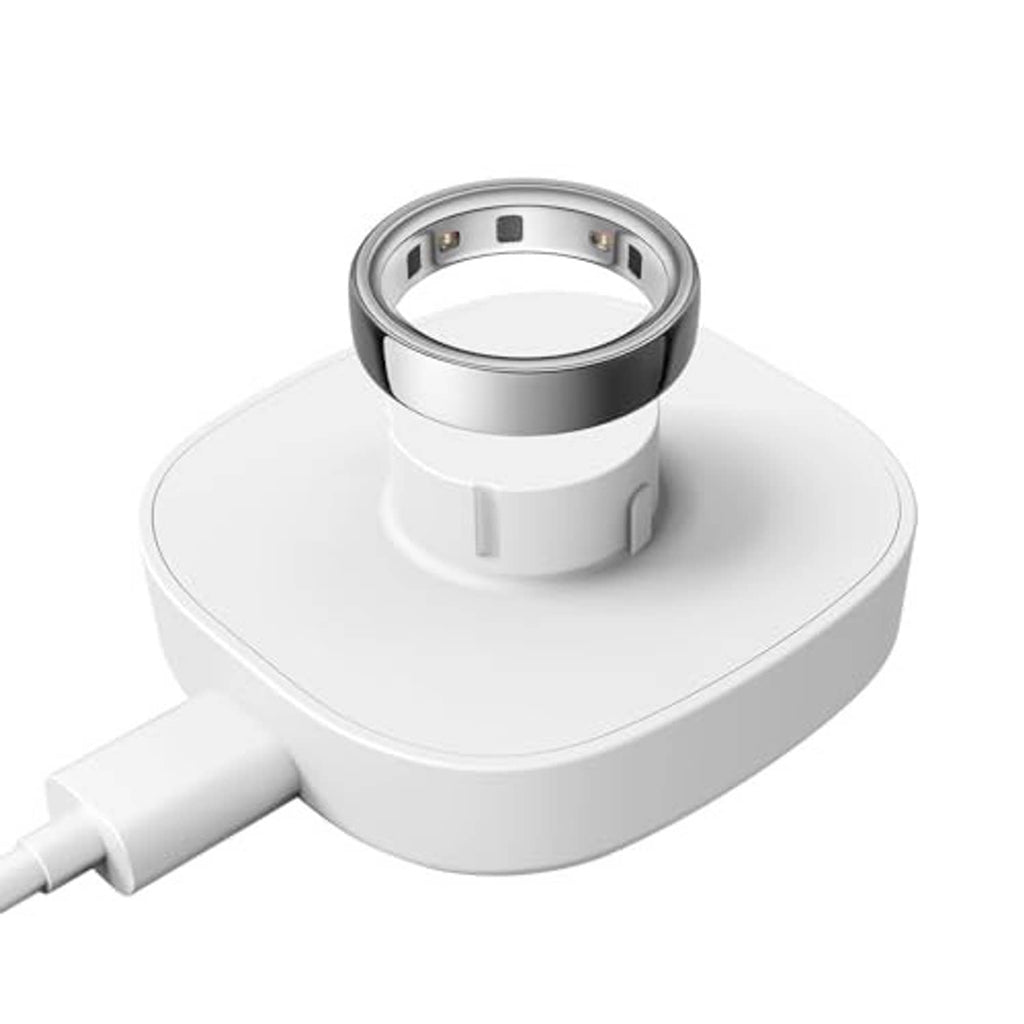 White charging dock with metal contact ring on top and visible USB-C cable