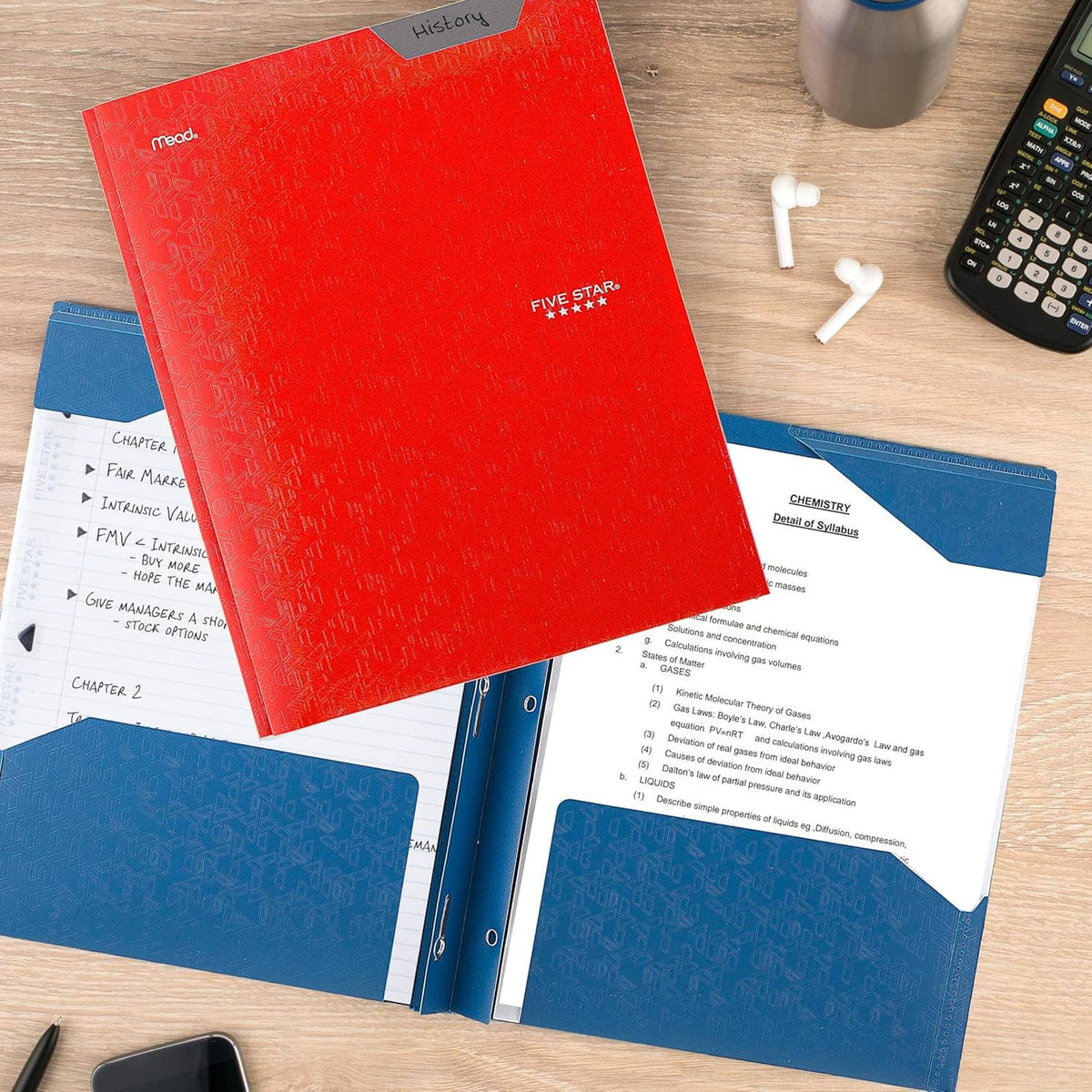 Red and blue prong folder with papers inside arranged on a desk