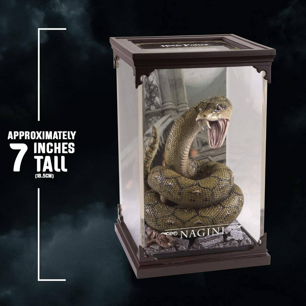 Tall glass display case with coiled green snake figurine and roaring mouth