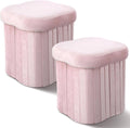 Set of 2 pink velvet storage ottomans with padded round tops and ribbed sides