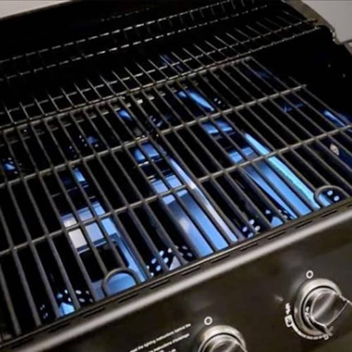 Black cast-iron cooking grate with parallel slats inside a grill