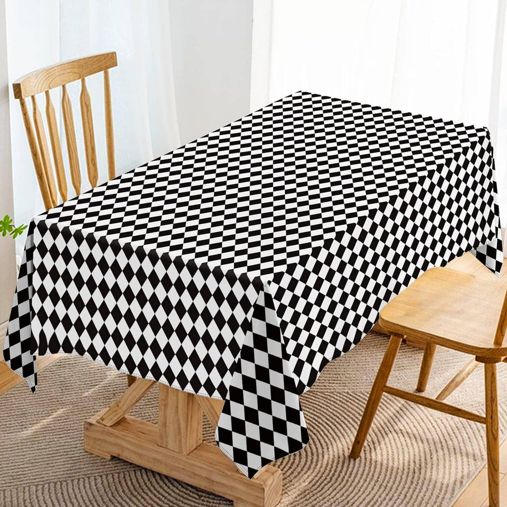 Black and white diamond check tablecloth covering a dining table