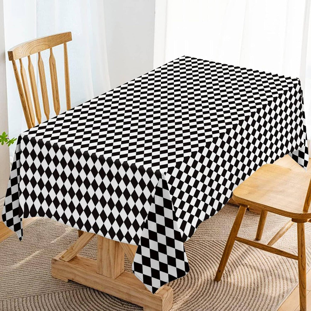 Black and white diamond check tablecloth covering a dining table