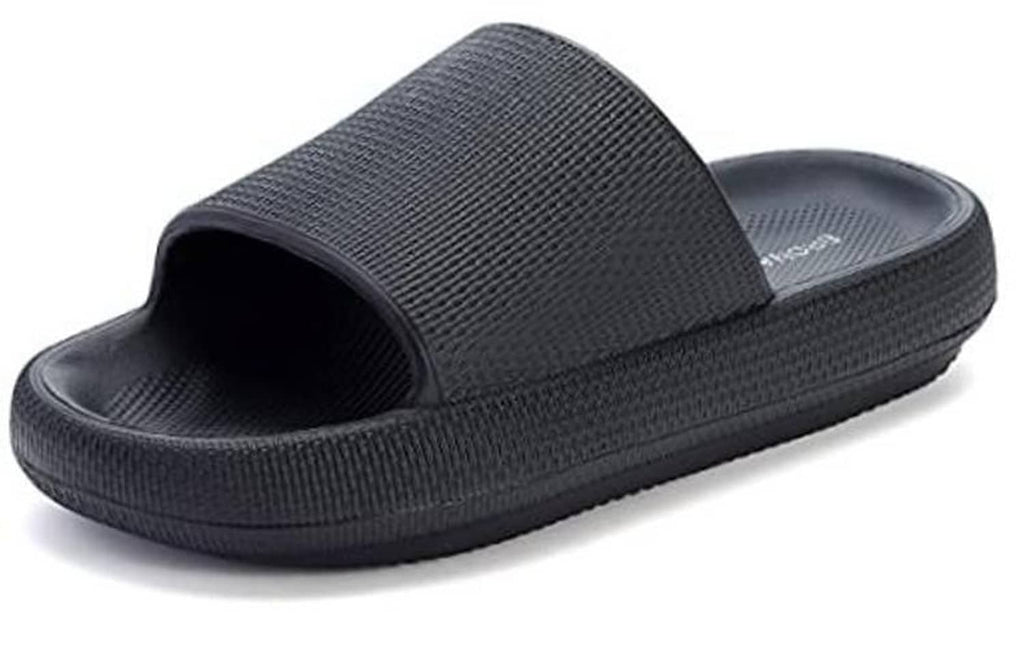 Black slip-on pillow slippers with wide textured strap and open toe.