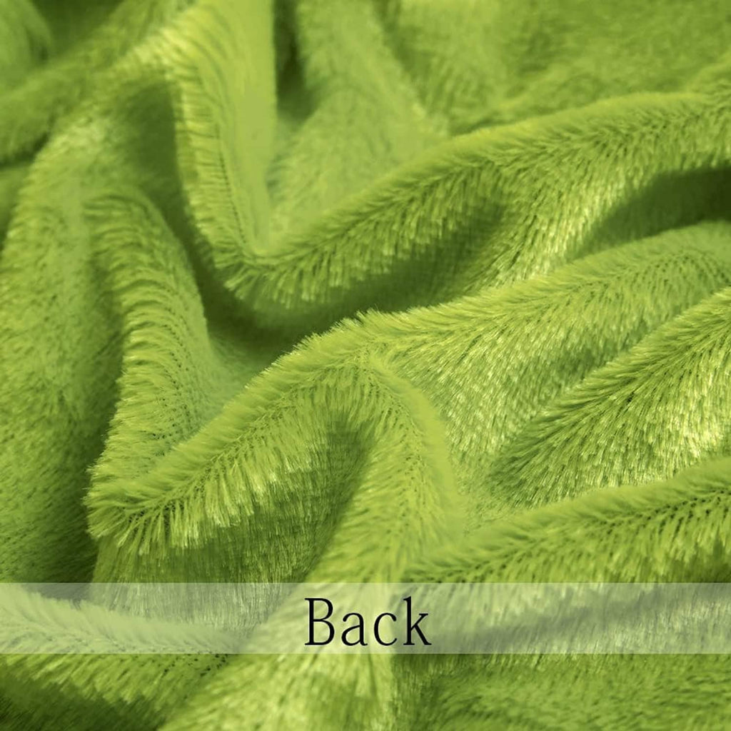 Bright green faux fur fabric swatch close-up, soft shag texture
