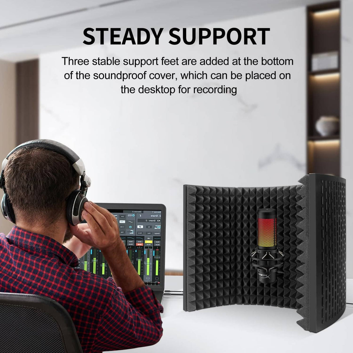 Microphone isolation shield with black acoustic foam panels and desk-mounted stand
