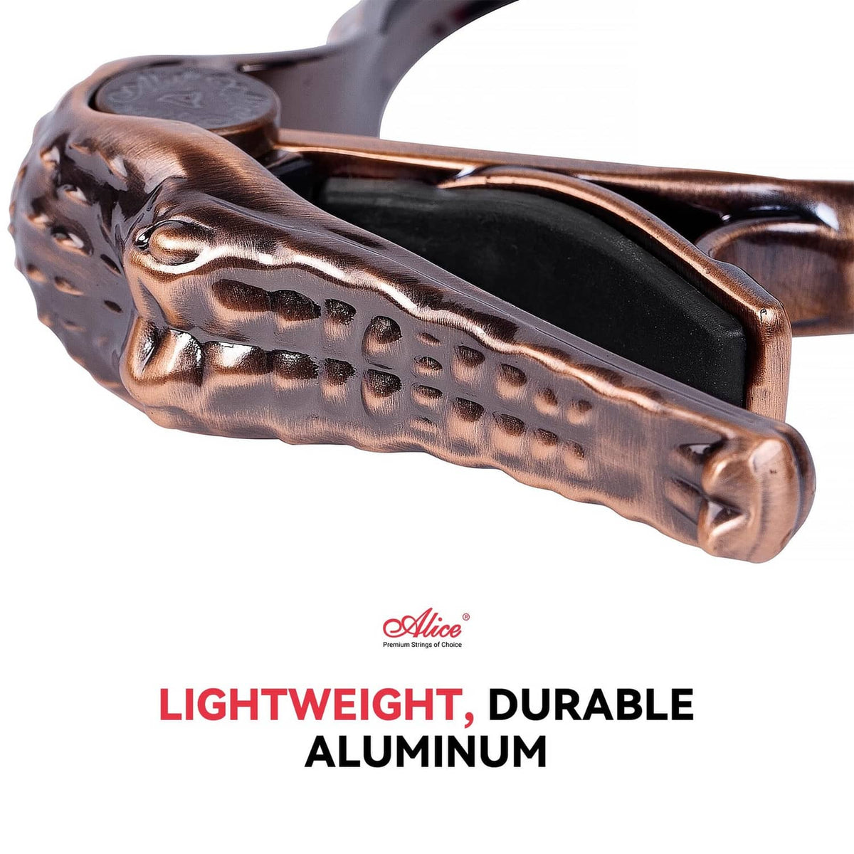 Bronze alligator-style guitar capo with black inner grip, detailed side view