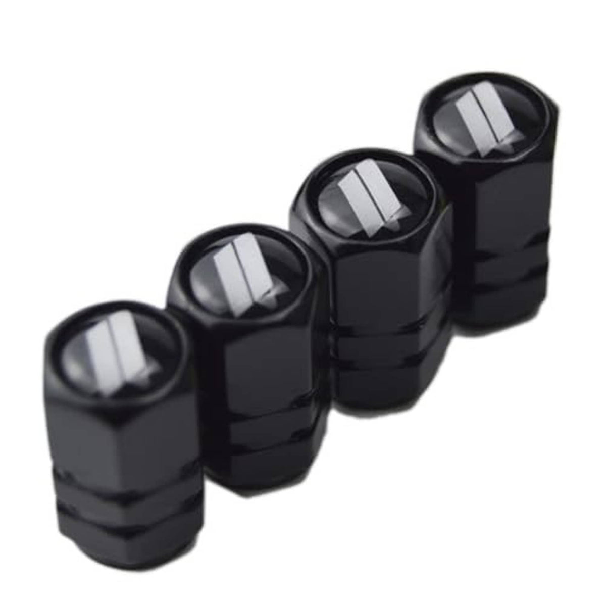 Set of four black valve stem caps with silver slash inserts, staggered row