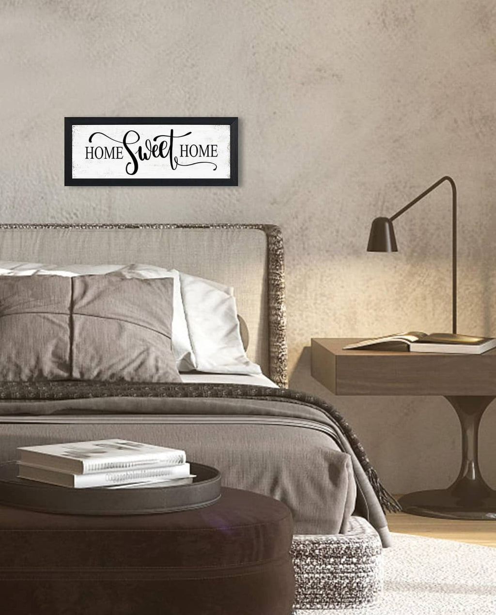 Black-framed wall sign reading “HOME Sweet HOME” with decorative script