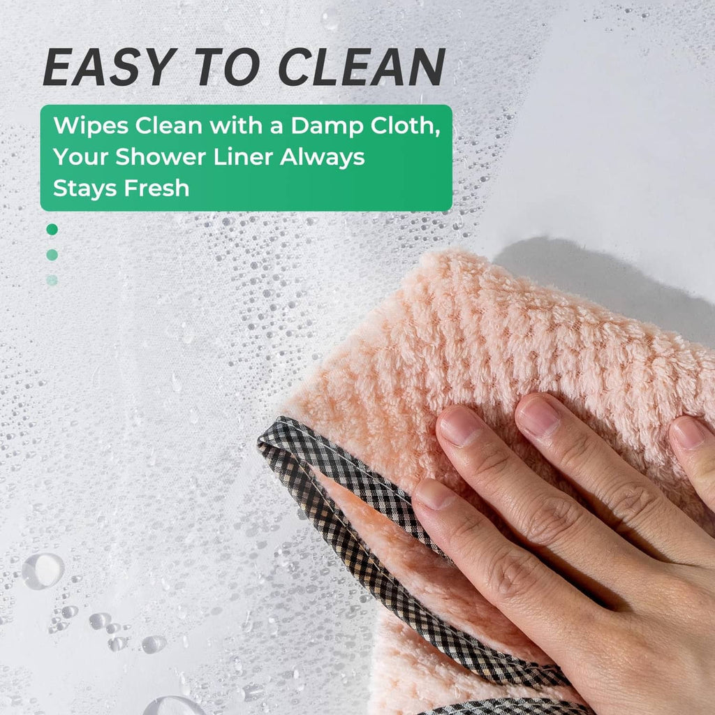 Clear shower curtain liner being wiped with a damp cloth to clean
