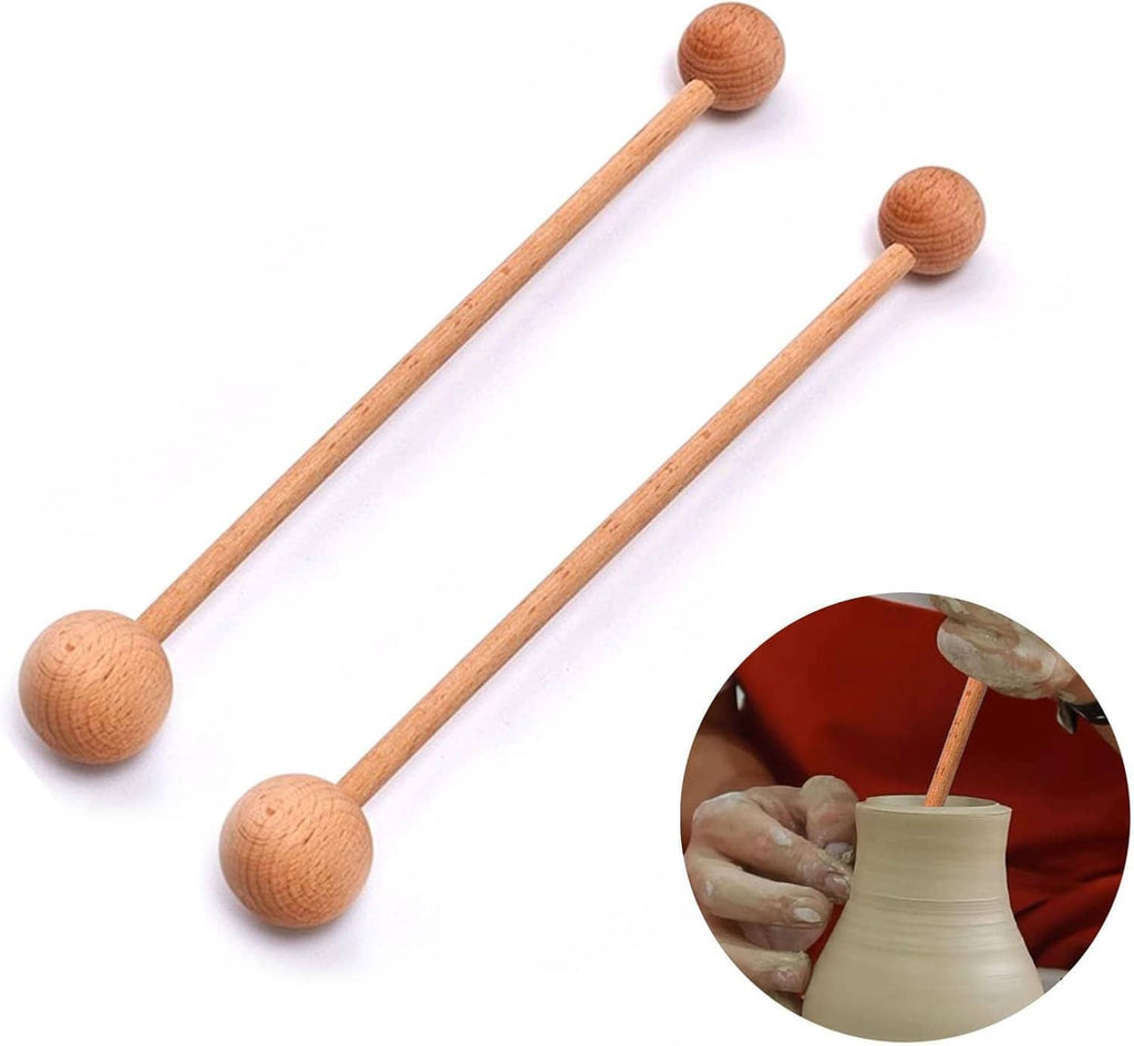 Pair of wooden pottery throwing sticks with round ball knobs on long handles.