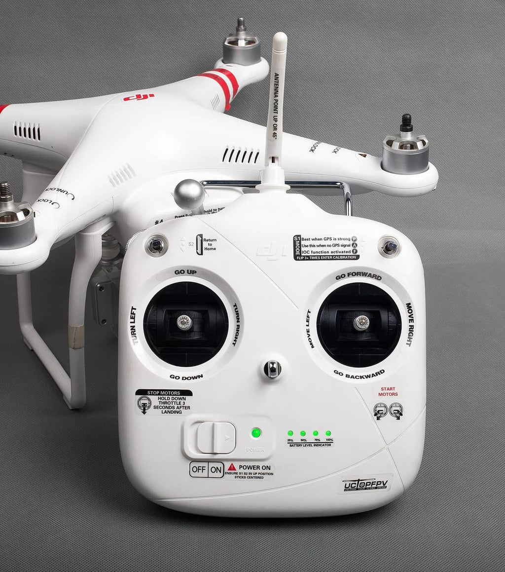 Drone body with red/black decal markings on arms and front