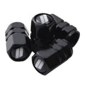 Set of four black tire valve stem caps with silver slash inserts, metal-look trim