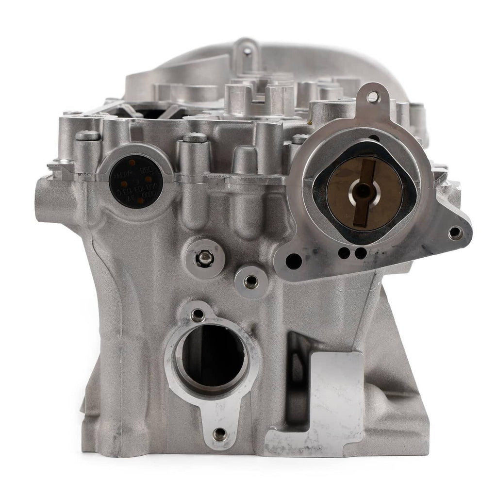 Cylinder head assembly with crank bearing opening, machined ports, and bolt bosses