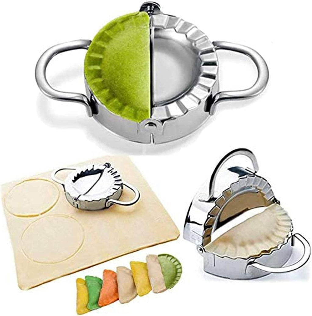 Stainless steel dumpling press with green filling half and scalloped crimp edge
