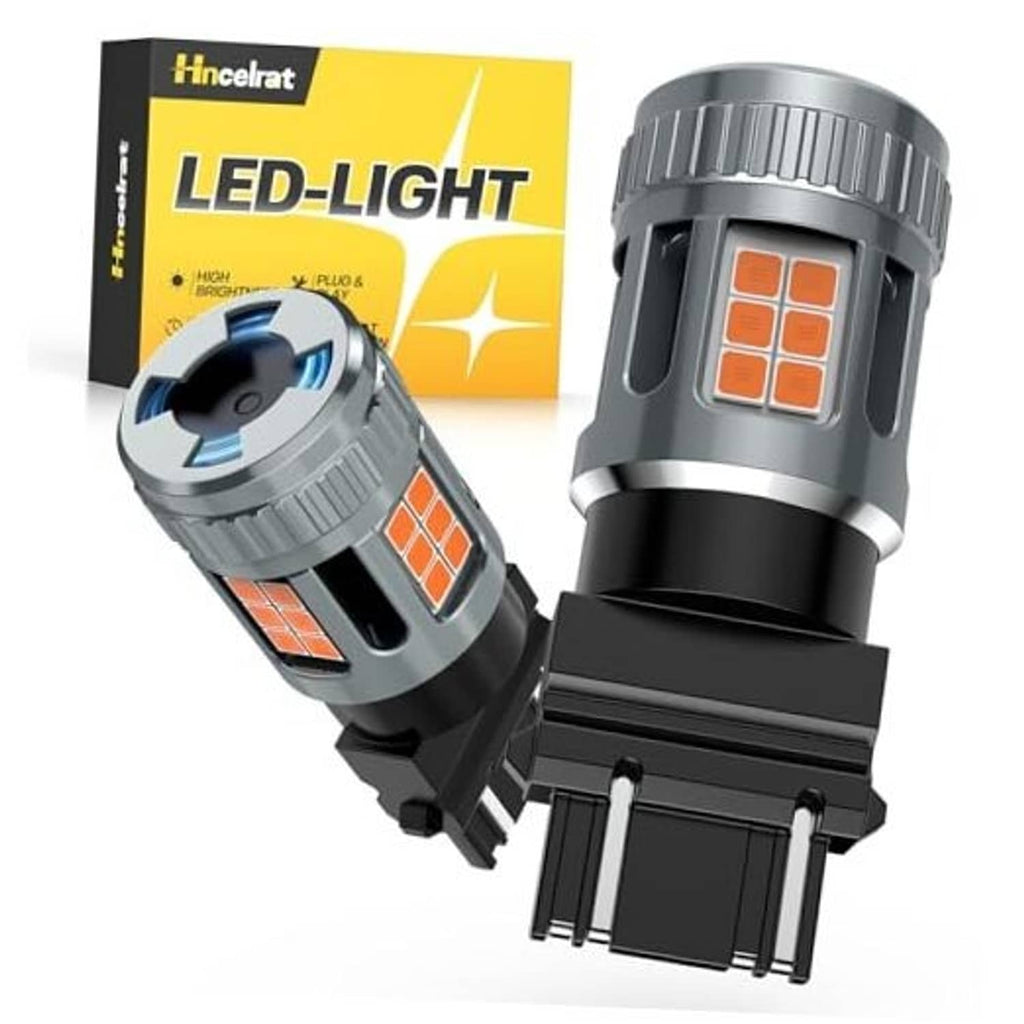 LED turn signal bulb with amber SMD light panel and wedge base, pair shown